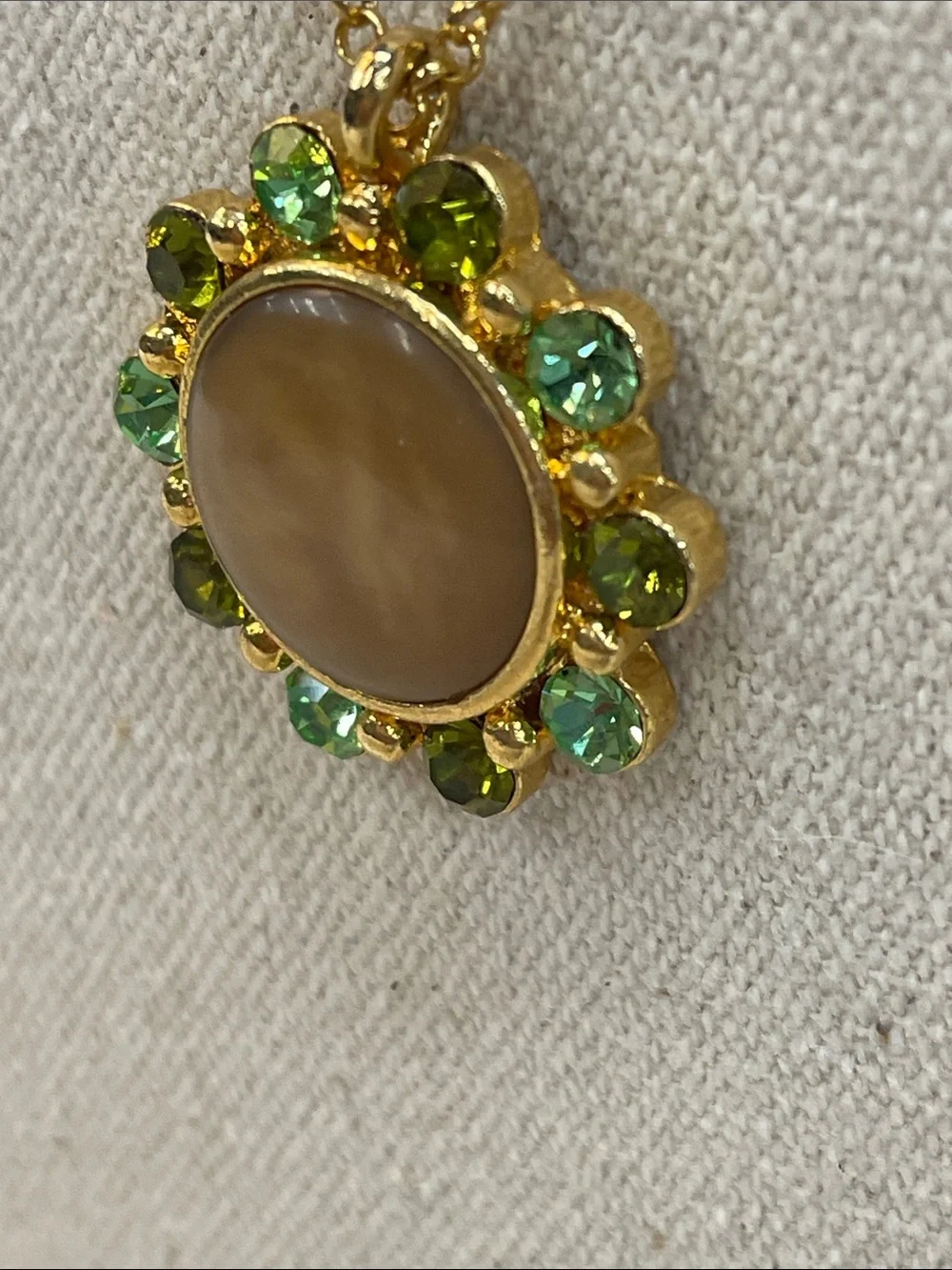 Gold-Tone Necklace with Beige Center and Green Crystal Halo
